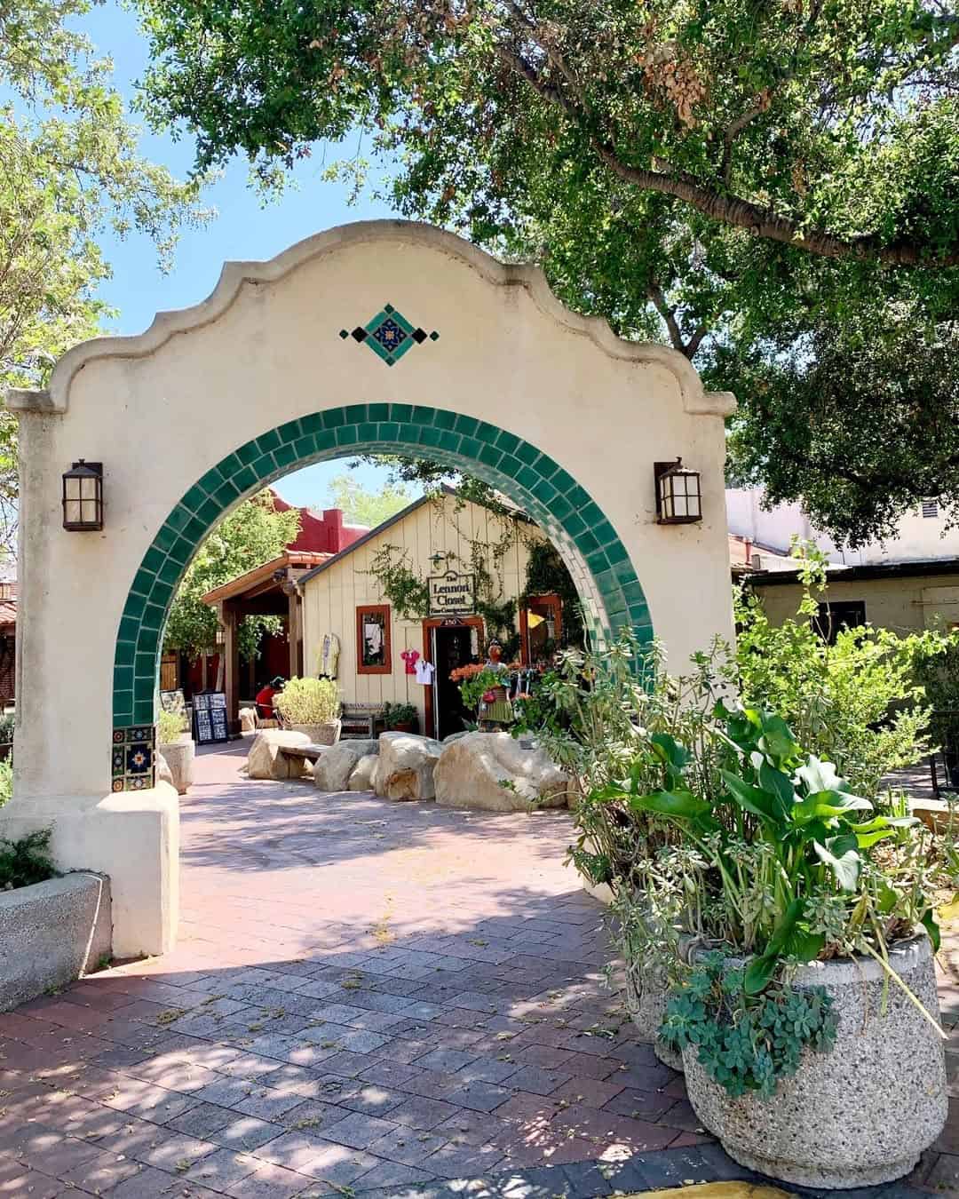 The historic Spanish-style green-tiled Ojai Arcade archway downtown in Ojai, California