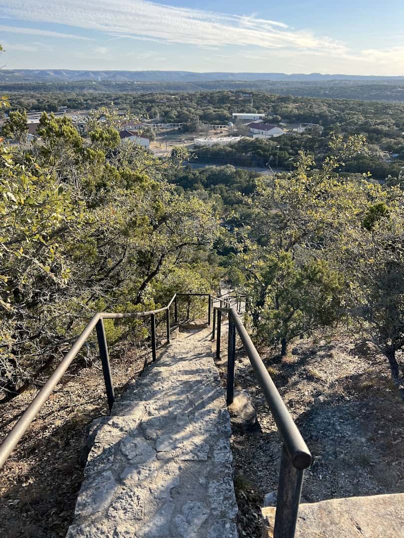 Stone steps and handrail leading down Old Baldy toward the valley