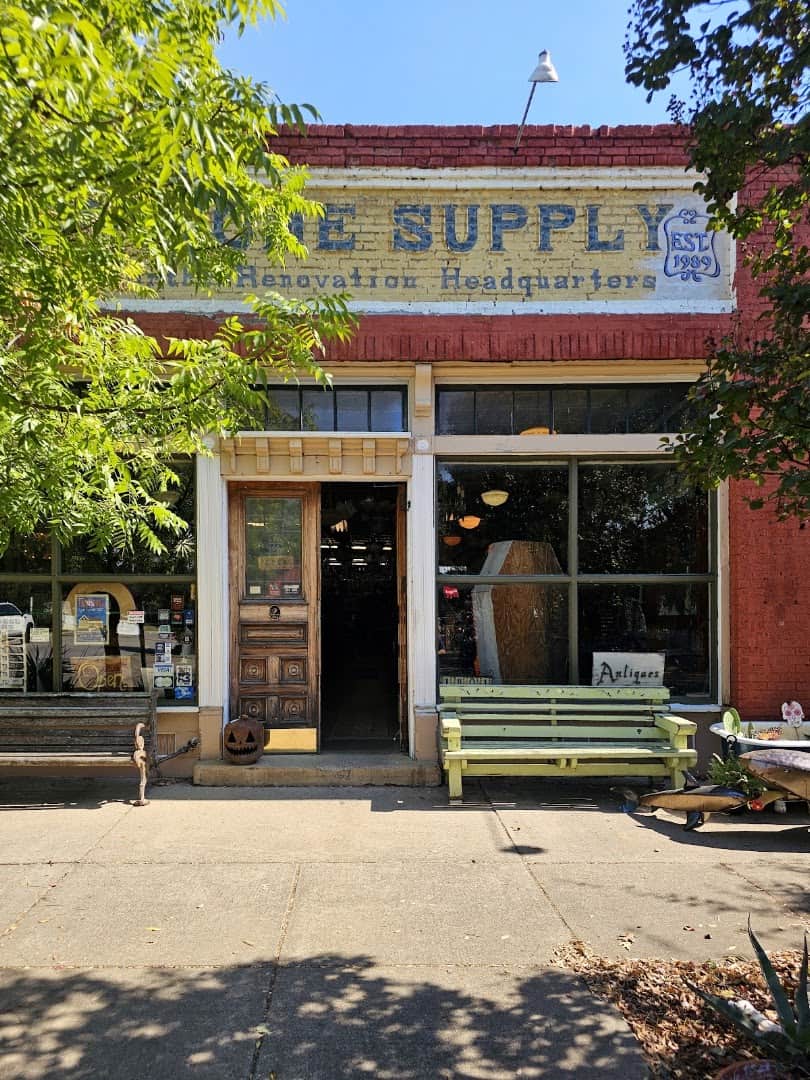 The hand-painted storefront sign of Old Home Supply House in the Fairmount neighborhood of Fort Worth