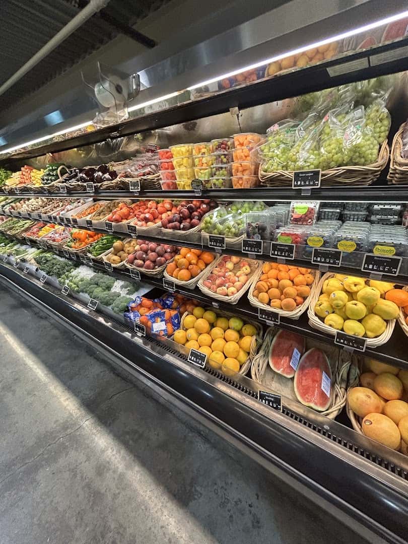 Olives and fresh produce piled high at Phoenicia Specialty Foods in Houston