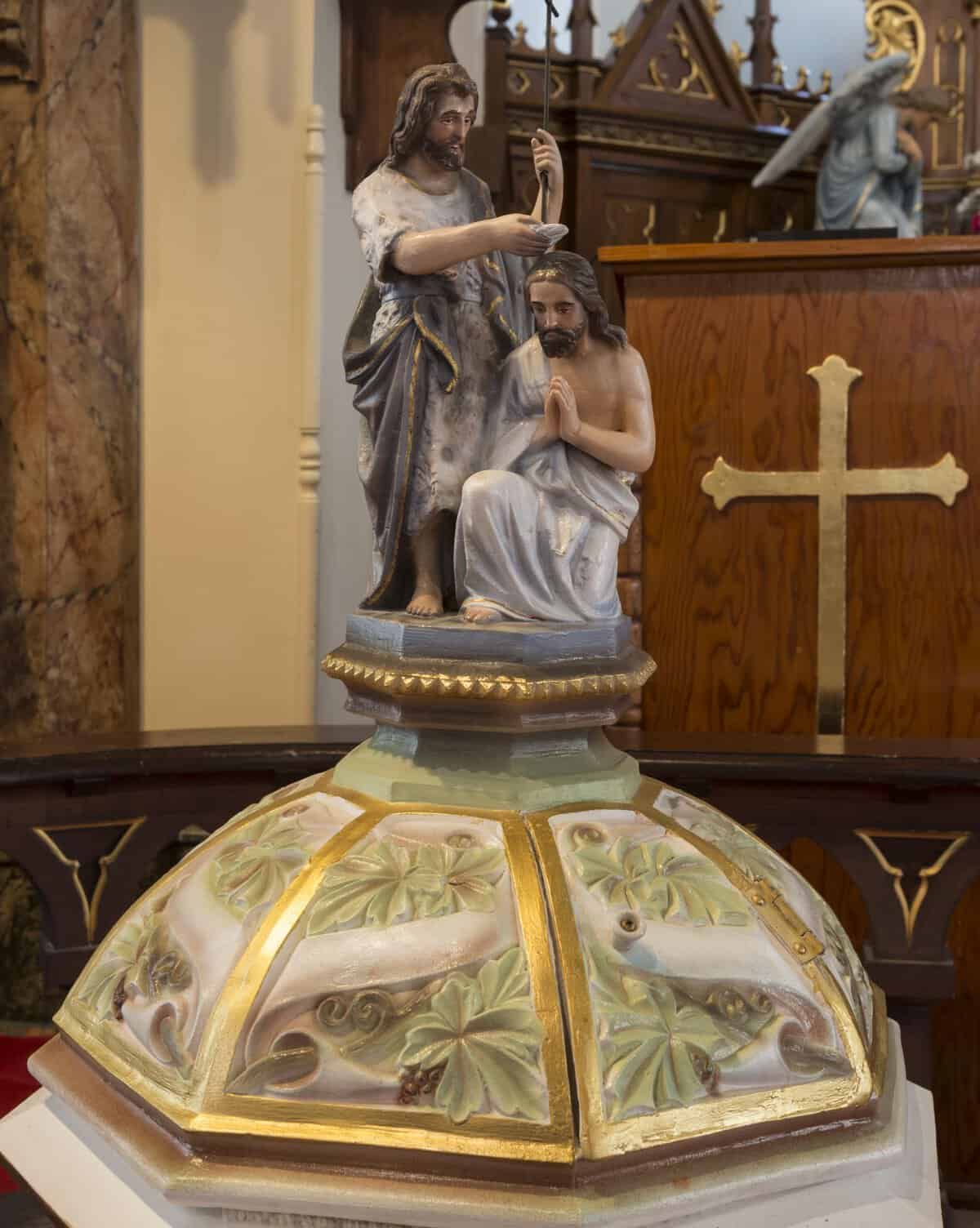 Ornate painted baptismal font at St. Mary Catholic Church in High Hill, Texas