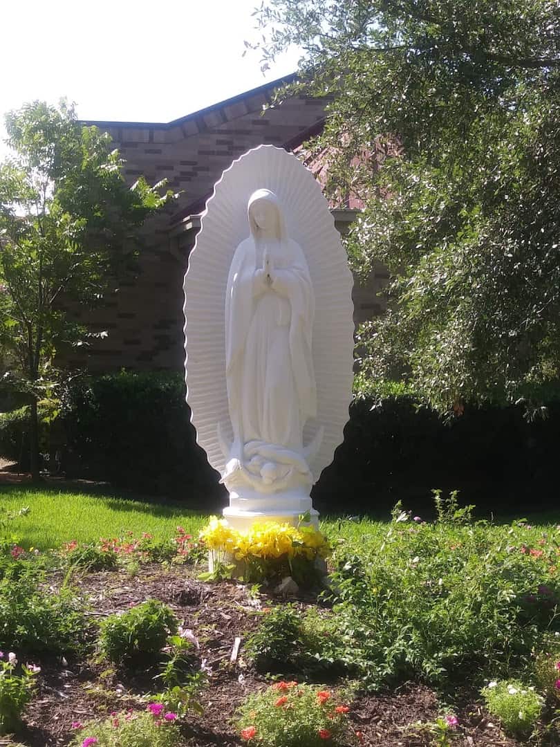 White Our Lady of Guadalupe statue in the garden shrine at St. Anthony Catholic Church in Bryan, Texas