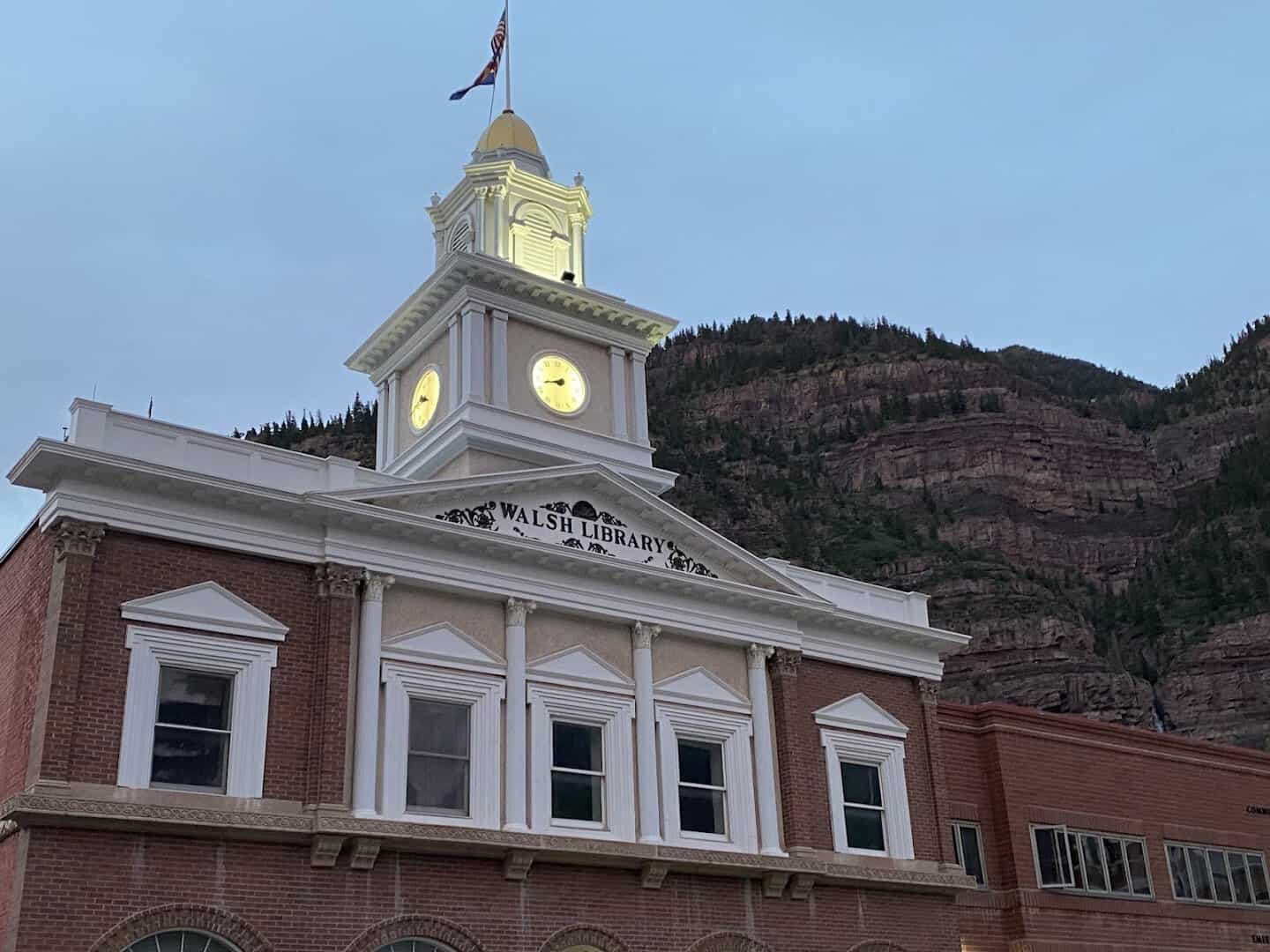 Historic downtown Ouray, Colorado framed by the red walls of its box canyon