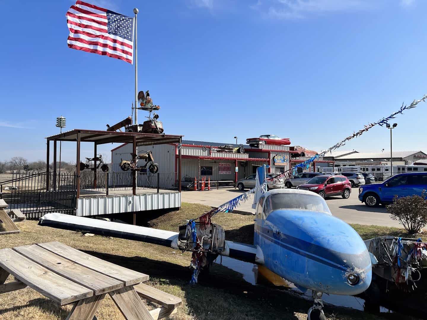 The covered outdoor patio and American flag at Bebo's and Kathy's Cafe in Pilot Point, Texas