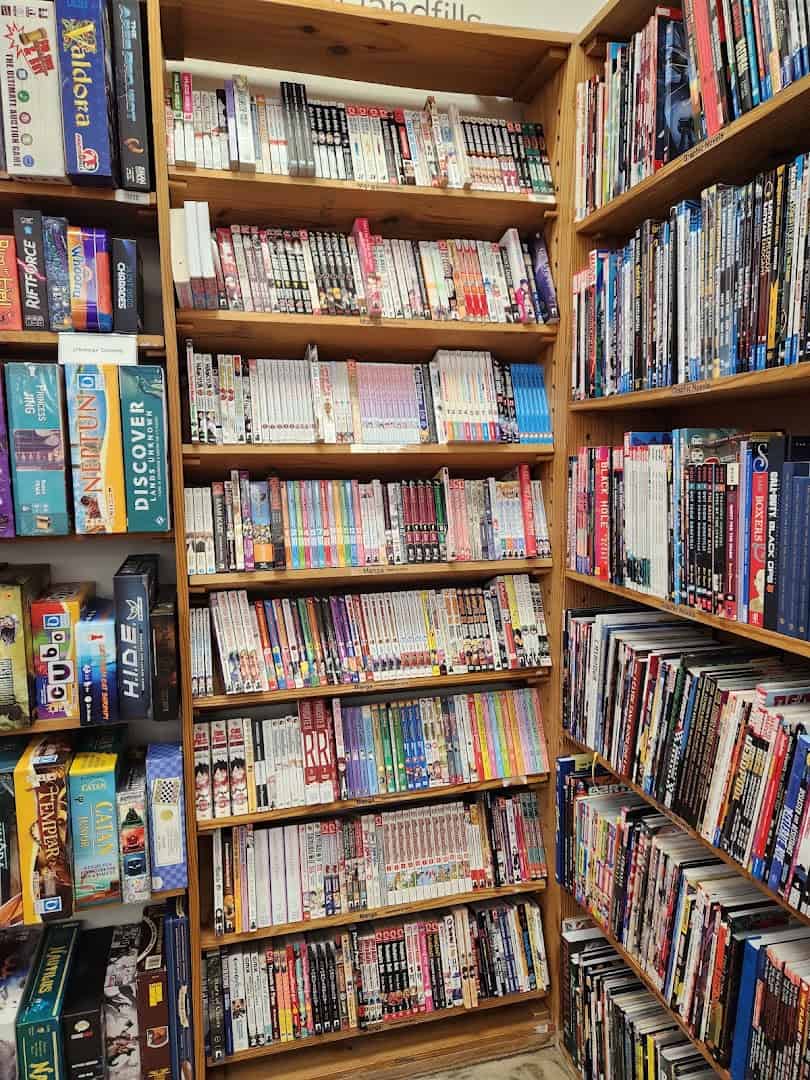 Tall packed shelves of manga, graphic novels and games at Half Price Books in Dallas