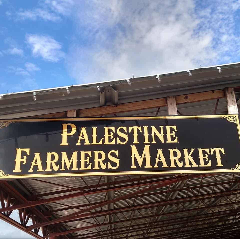 The Palestine Farmers Market sign at the historic Main Street pavilion