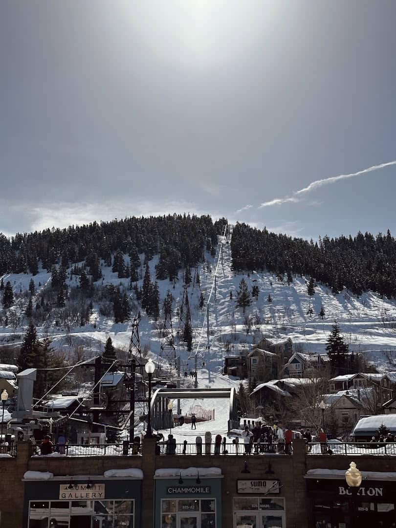 Snow-covered Town Lift ski run dropping to the shops of Historic Main Street in Park City, Utah