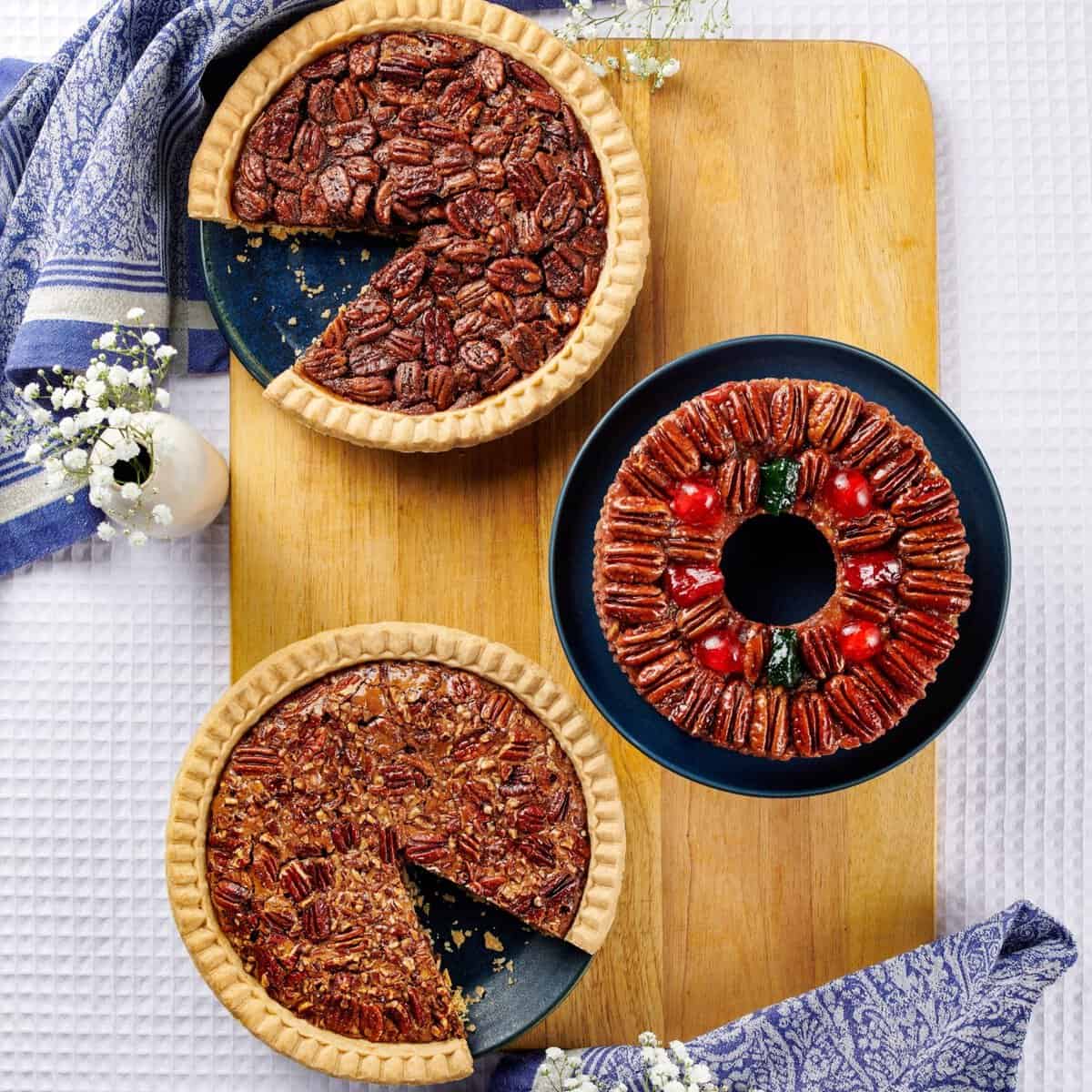 Pecan pies on a wooden board at Collin Street Bakery in Corsicana