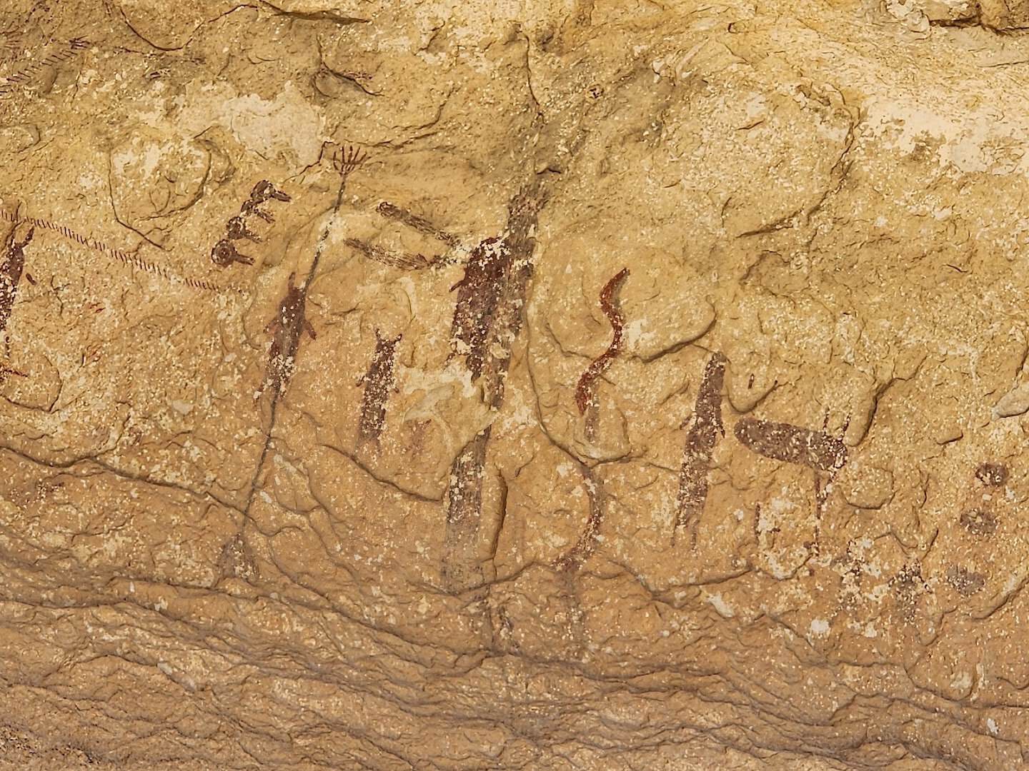 Ancient pictograph figures painted on a canyon wall at Seminole Canyon