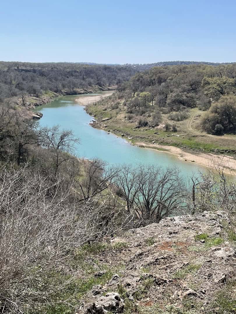 Turquoise bend of the Pedernales River seen from a canyon overlook at Milton Reimers Ranch Park
