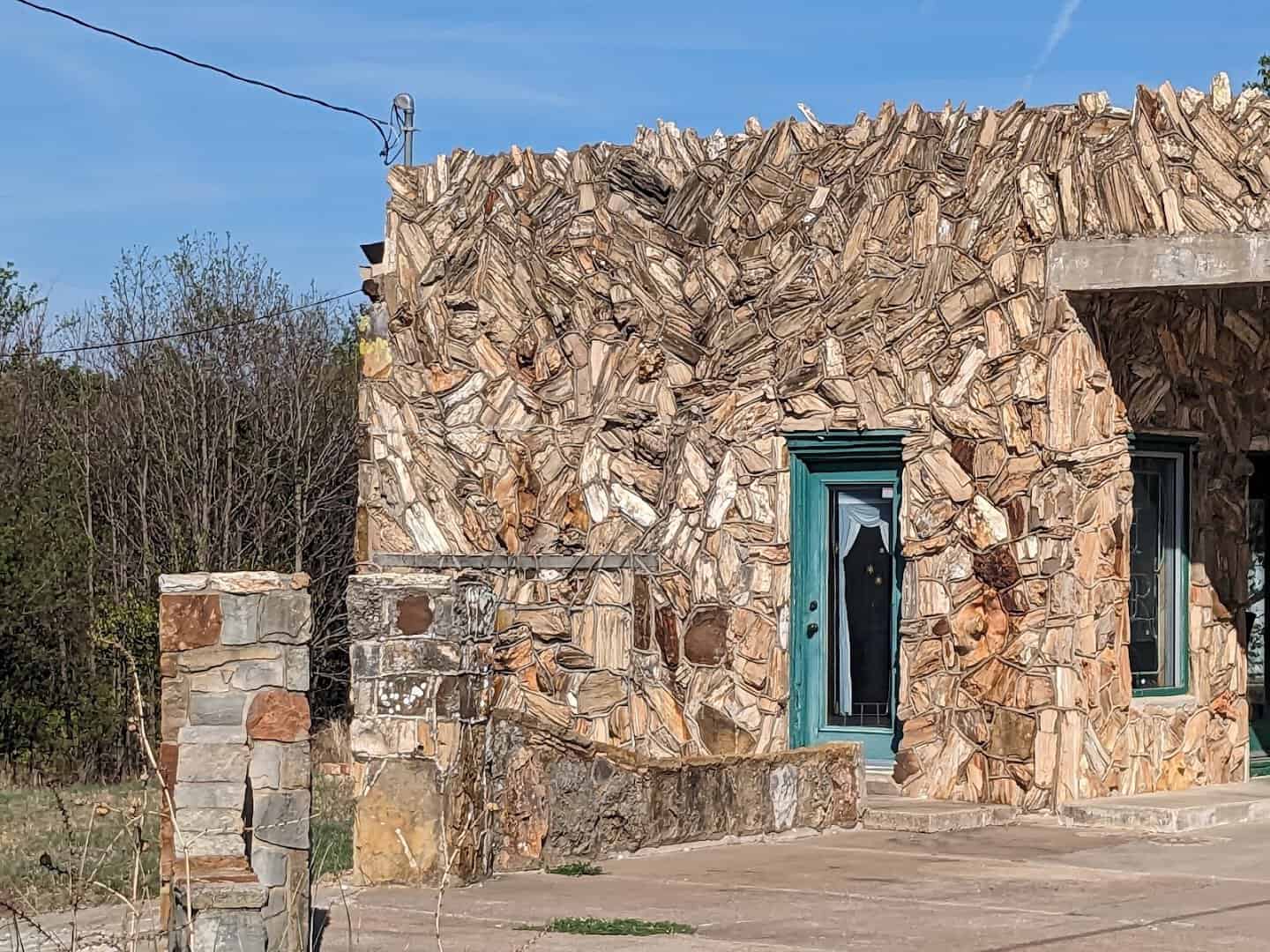 Petrified wood cabin at the historic Texas Tourist Camp in Decatur, Texas