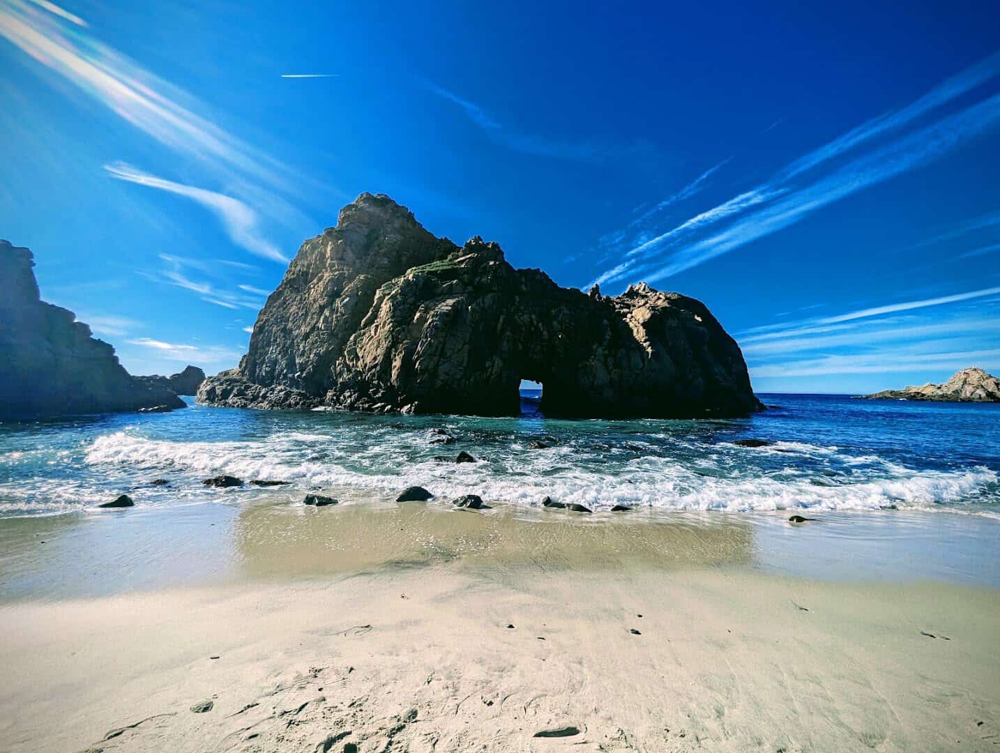 The iconic rock formation in the surf at Pfeiffer Beach, Big Sur, California