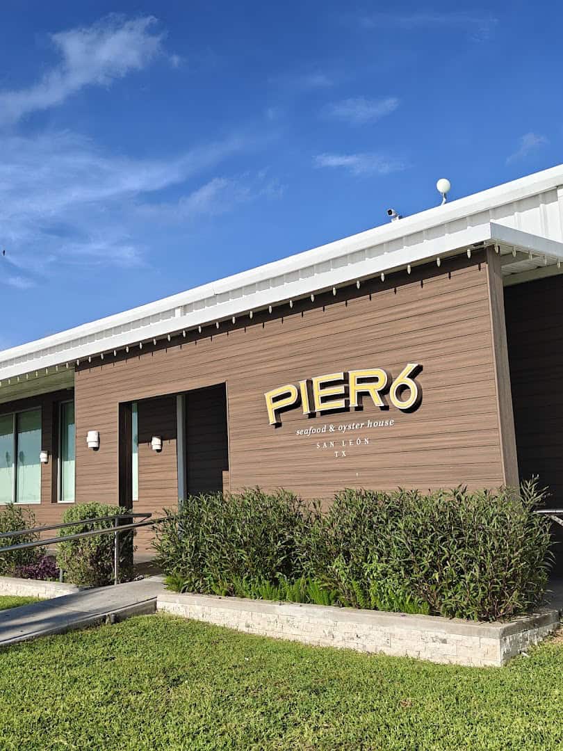 Exterior sign at Pier 6 Seafood and Oyster House in San Leon, Texas