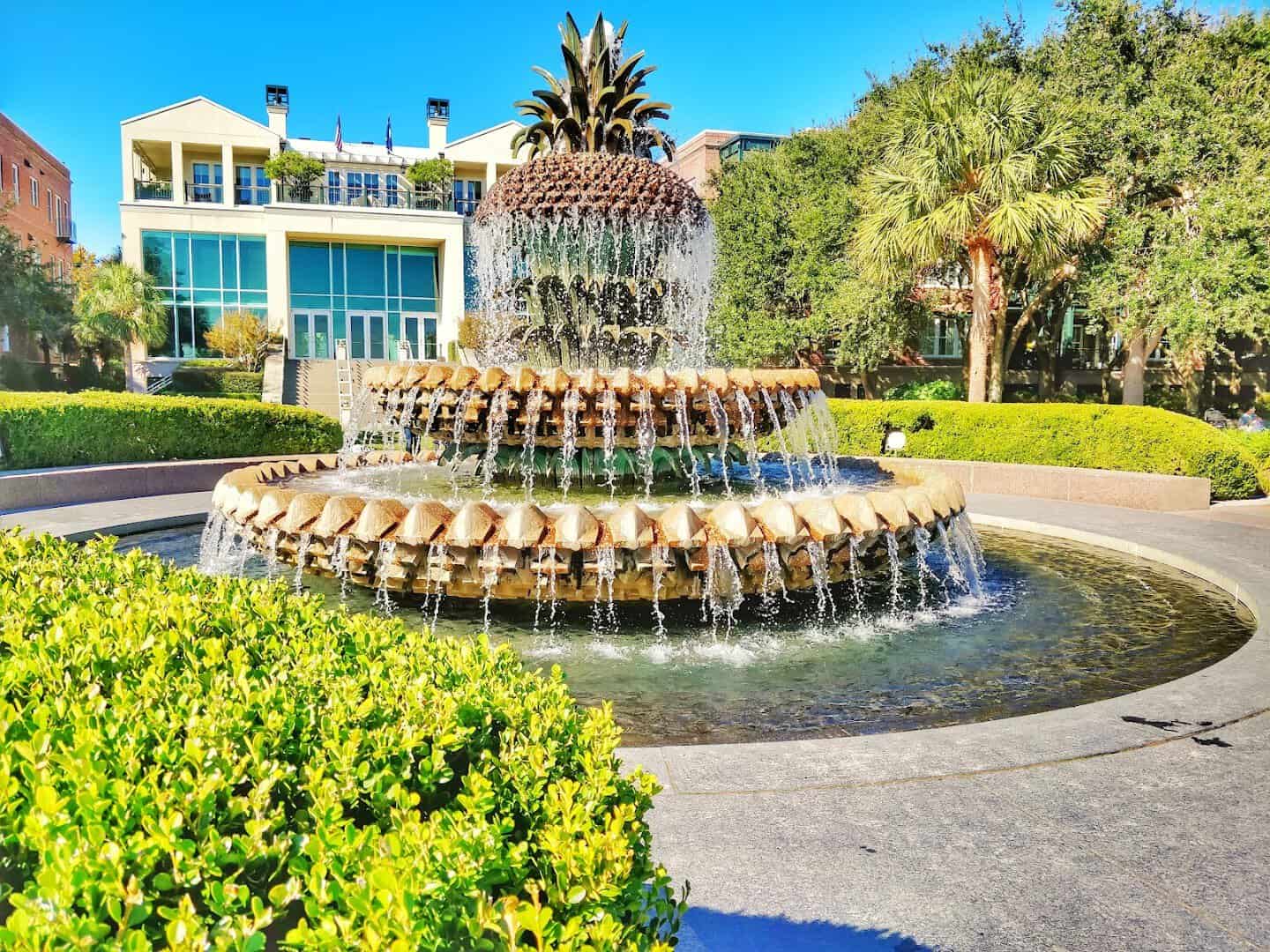 The Pineapple Fountain amid green gardens at Waterfront Park in Charleston, SC