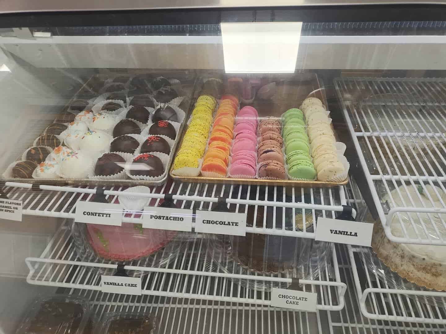 Case of pink iced cookies and macarons at Naegelin's Bakery in New Braunfels