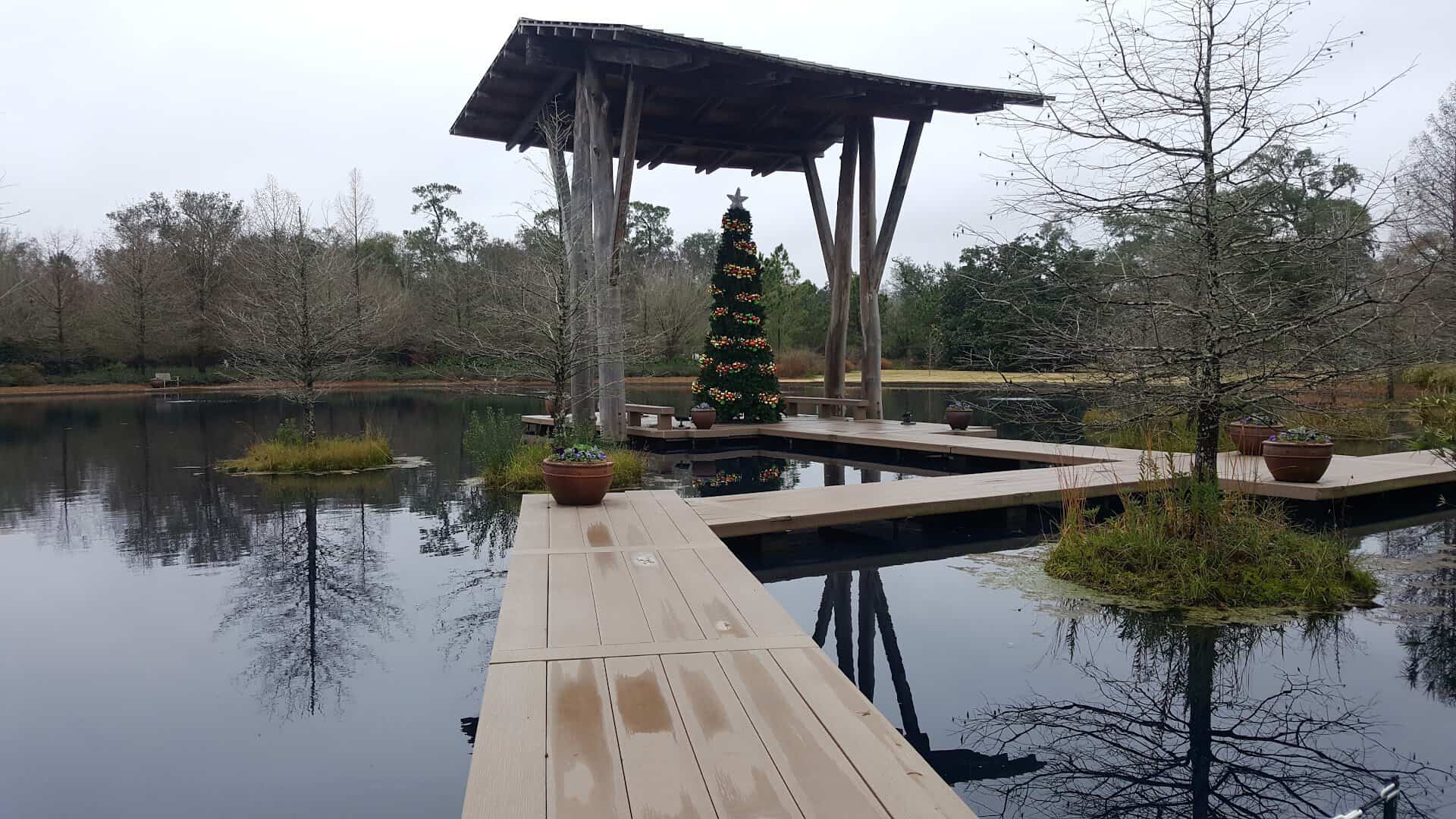 Pavilion mirrored in the still Pond of the Blue Moon at Shangri La in Orange, Texas