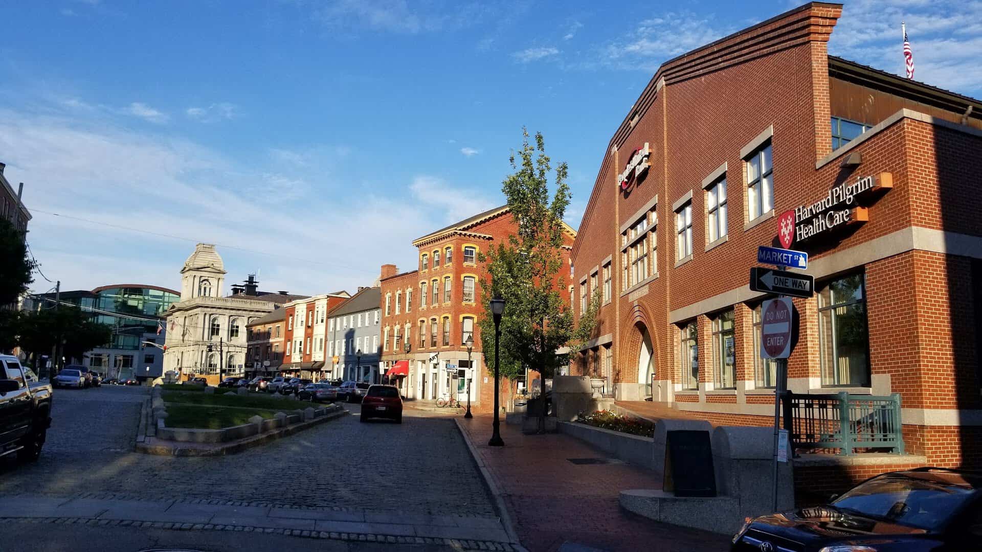 Historic 1800s brick buildings lining a street in Portland's Old Port, Maine