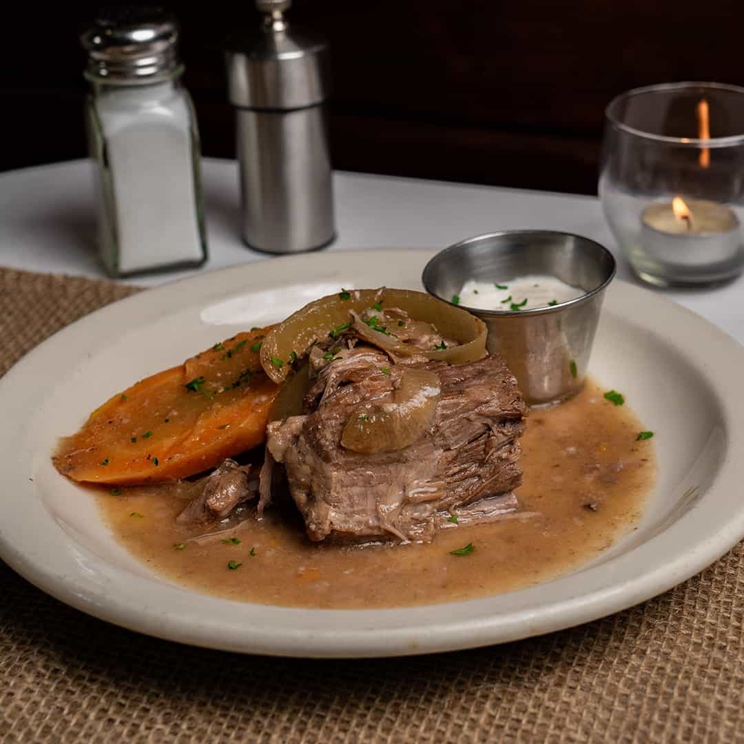 Pot roast with gravy, carrots and onions at Celebration Restaurant in Dallas