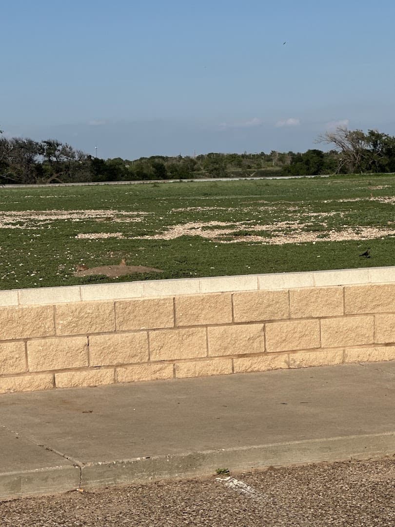 Low cinder block viewing wall around Prairie Dog Town in Mackenzie Park, Lubbock
