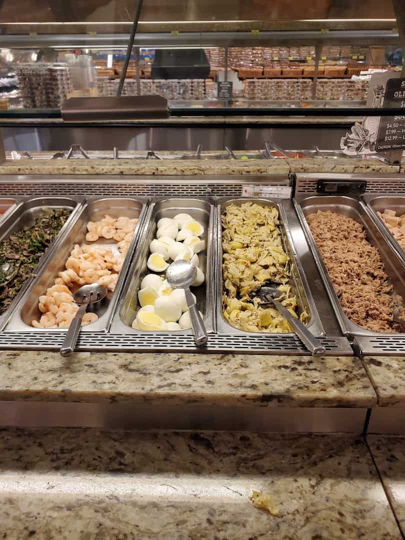 Prepared salad and olive bar with shrimp and artichokes at Phoenicia Specialty Foods in Houston