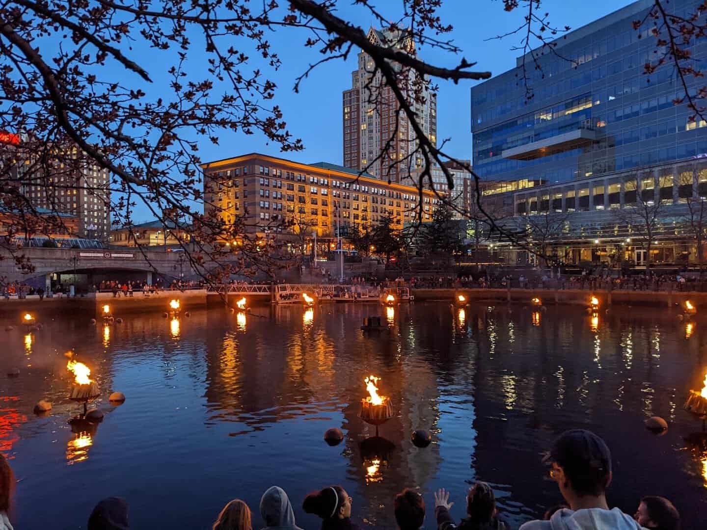 WaterFire braziers burning on the river at dusk in downtown Providence, Rhode Island