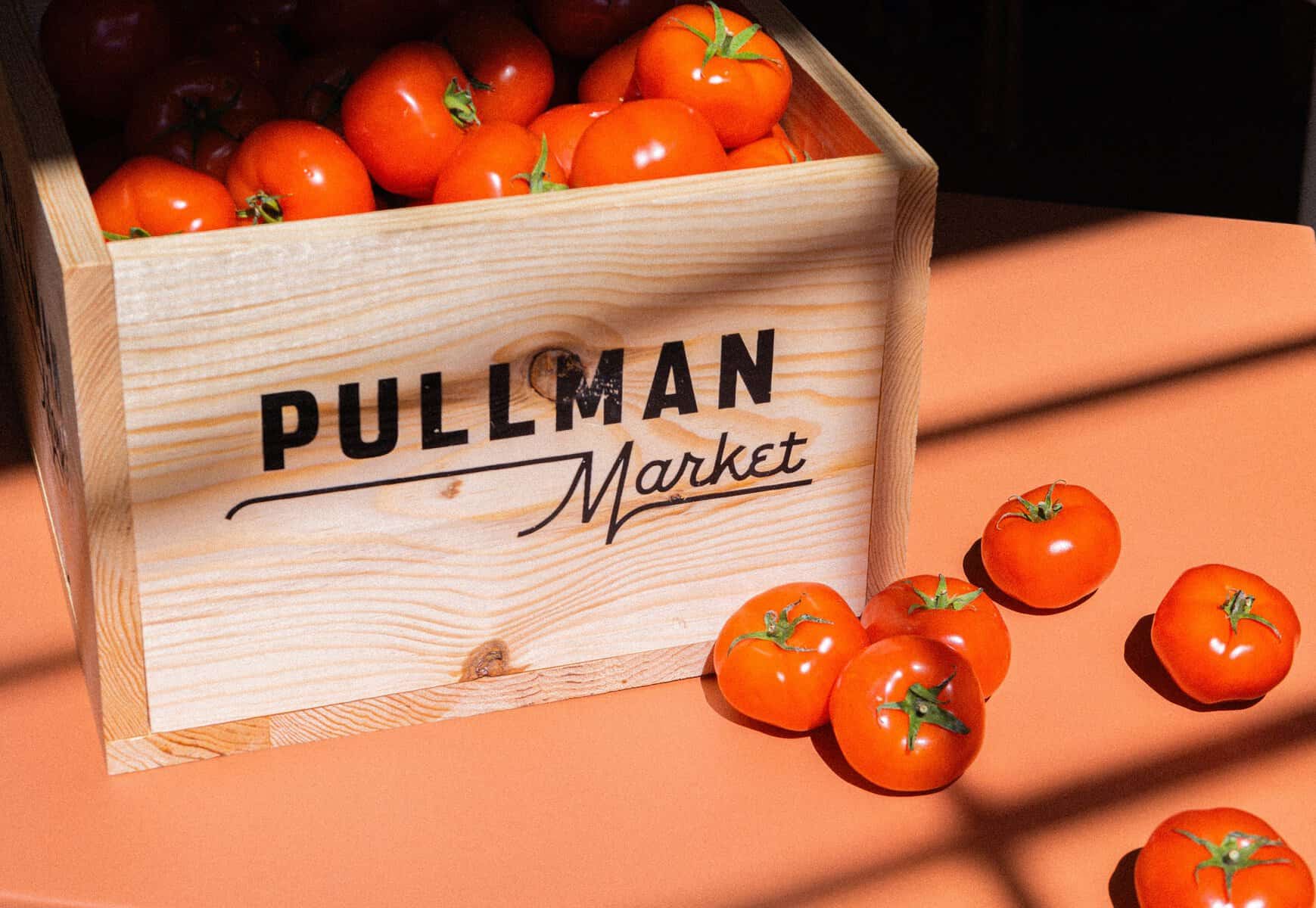 A Pullman Market crate of ripe heirloom tomatoes