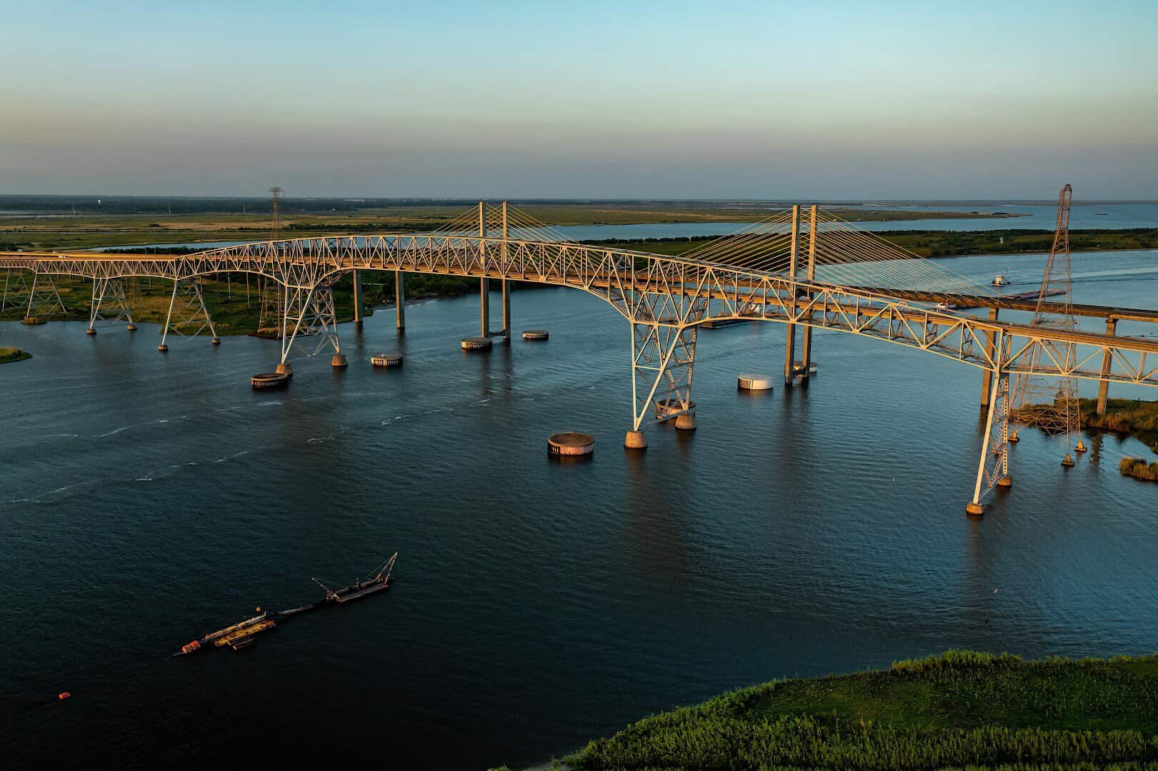 Aerial view of the Rainbow Bridge over the Neches River at golden hour, Texas