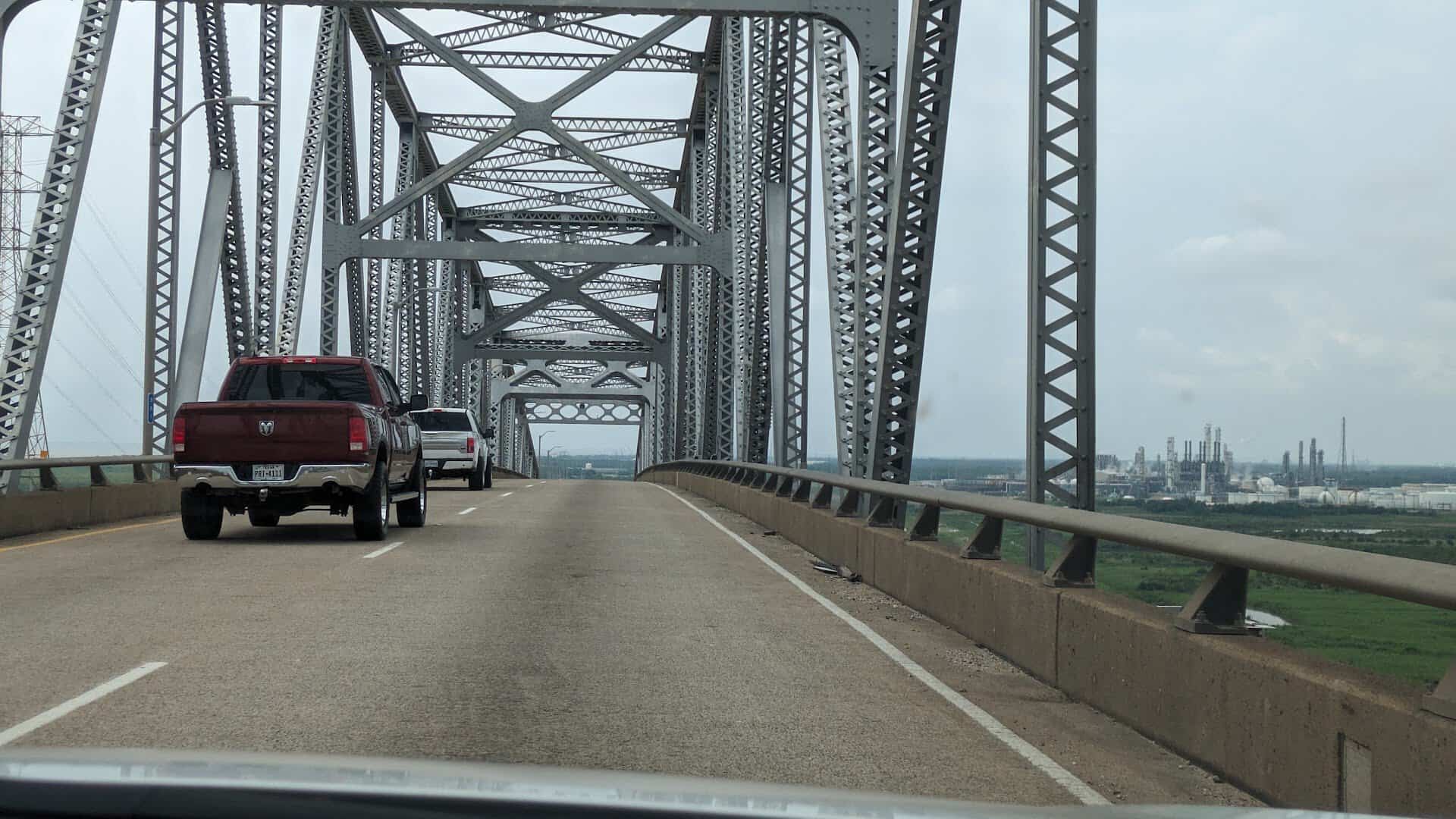 Driving through the steel trusses of the Rainbow Bridge near Port Arthur, Texas