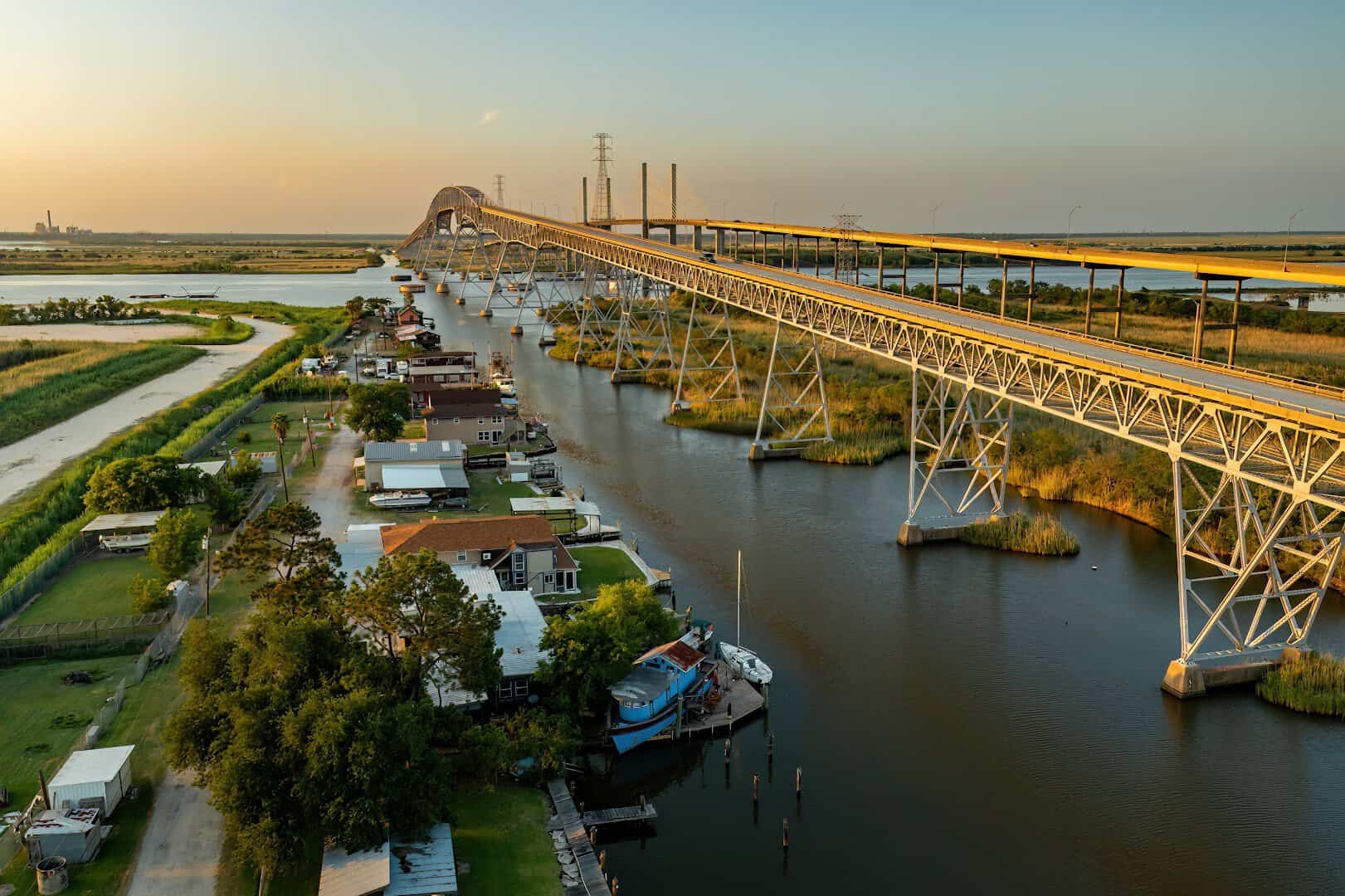 Golden hour aerial of the Rainbow Bridge over the Neches River near Port Arthur