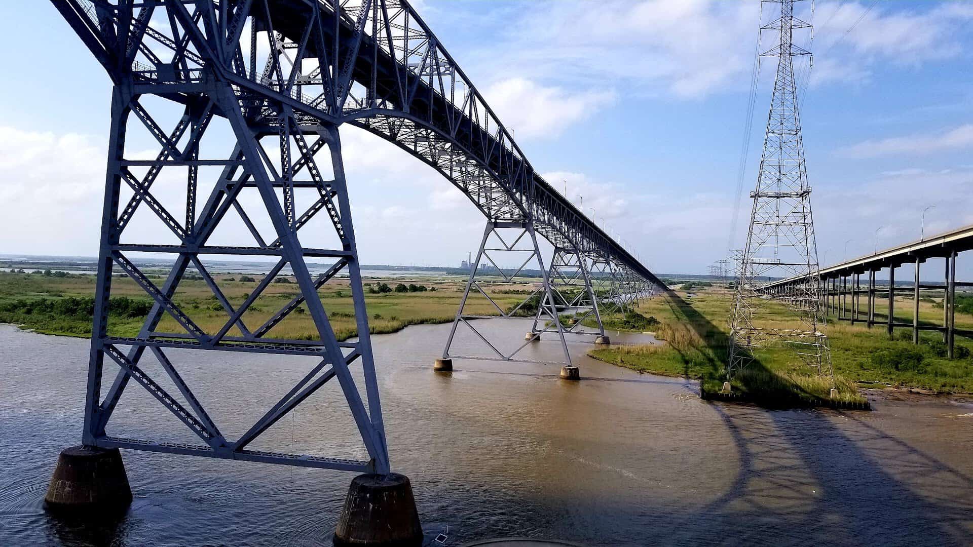 The tall steel arch of the Rainbow Bridge rising over the Neches River in Southeast Texas