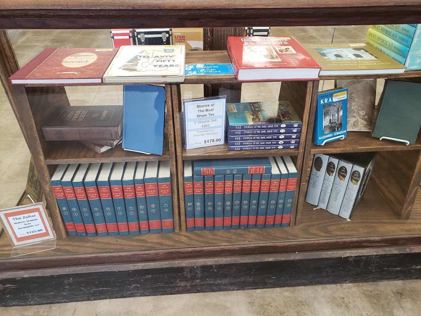 Rare and collectible book sets in a glass display case at Half Price Books in Dallas