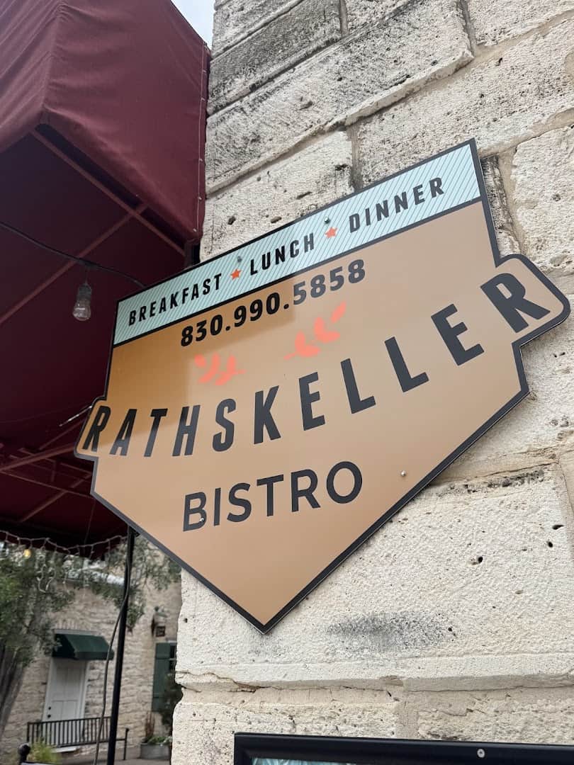Rathskeller Bistro sign on the limestone wall in Fredericksburg