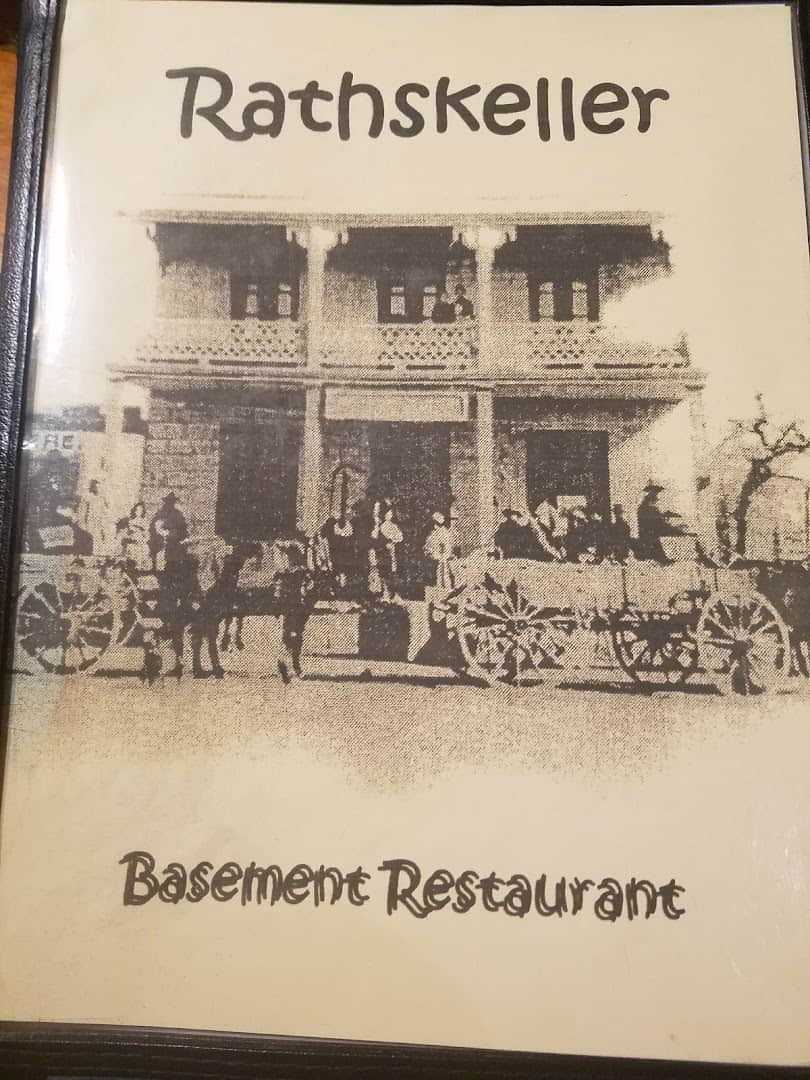 Rathskeller menu cover with a drawing of the historic Priess building in Fredericksburg