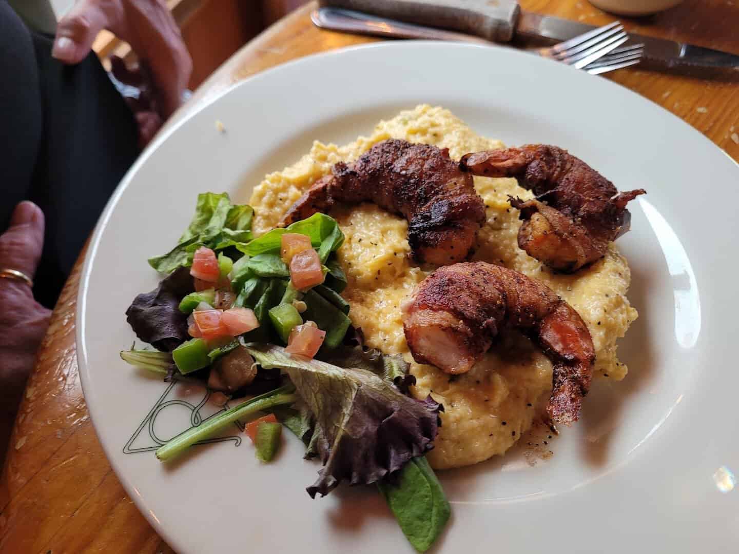 Bacon-wrapped shrimp over cheese grits at Reata in Alpine, Texas
