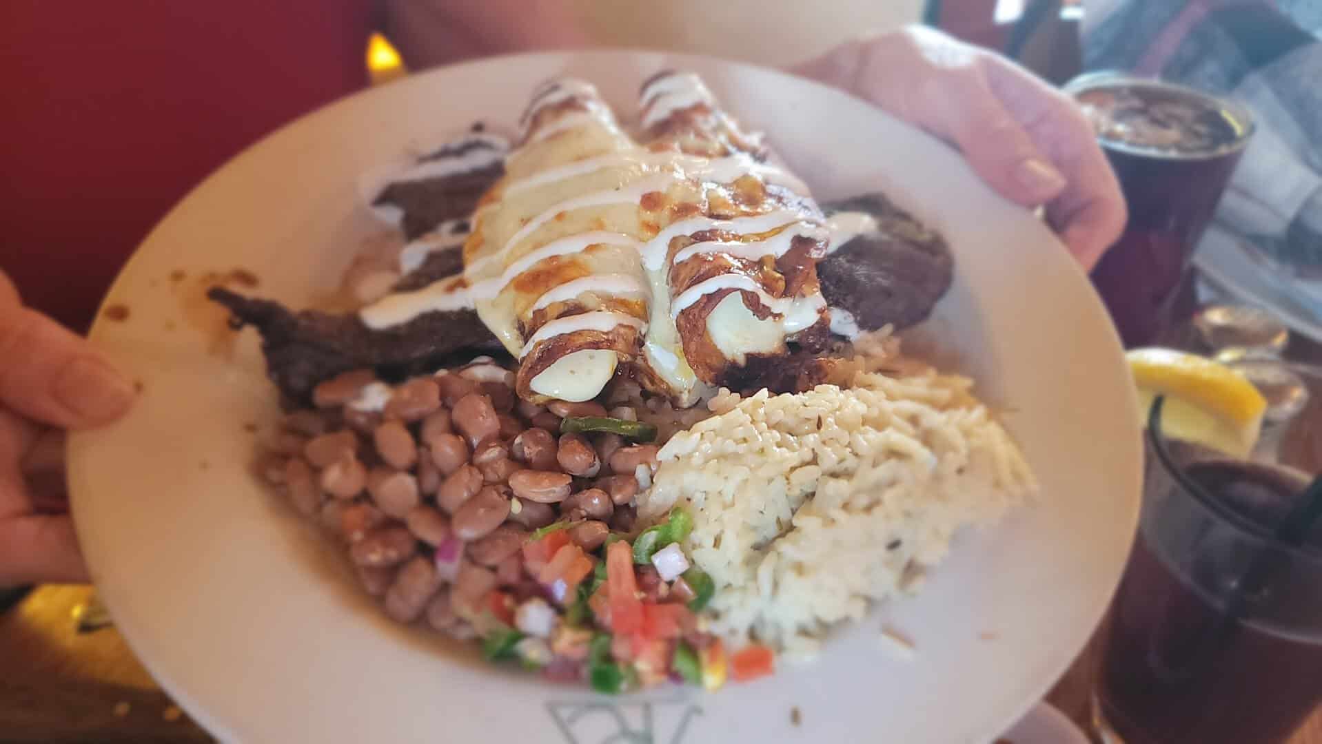 Carne asada topped with cheese enchiladas at Reata in Alpine, Texas