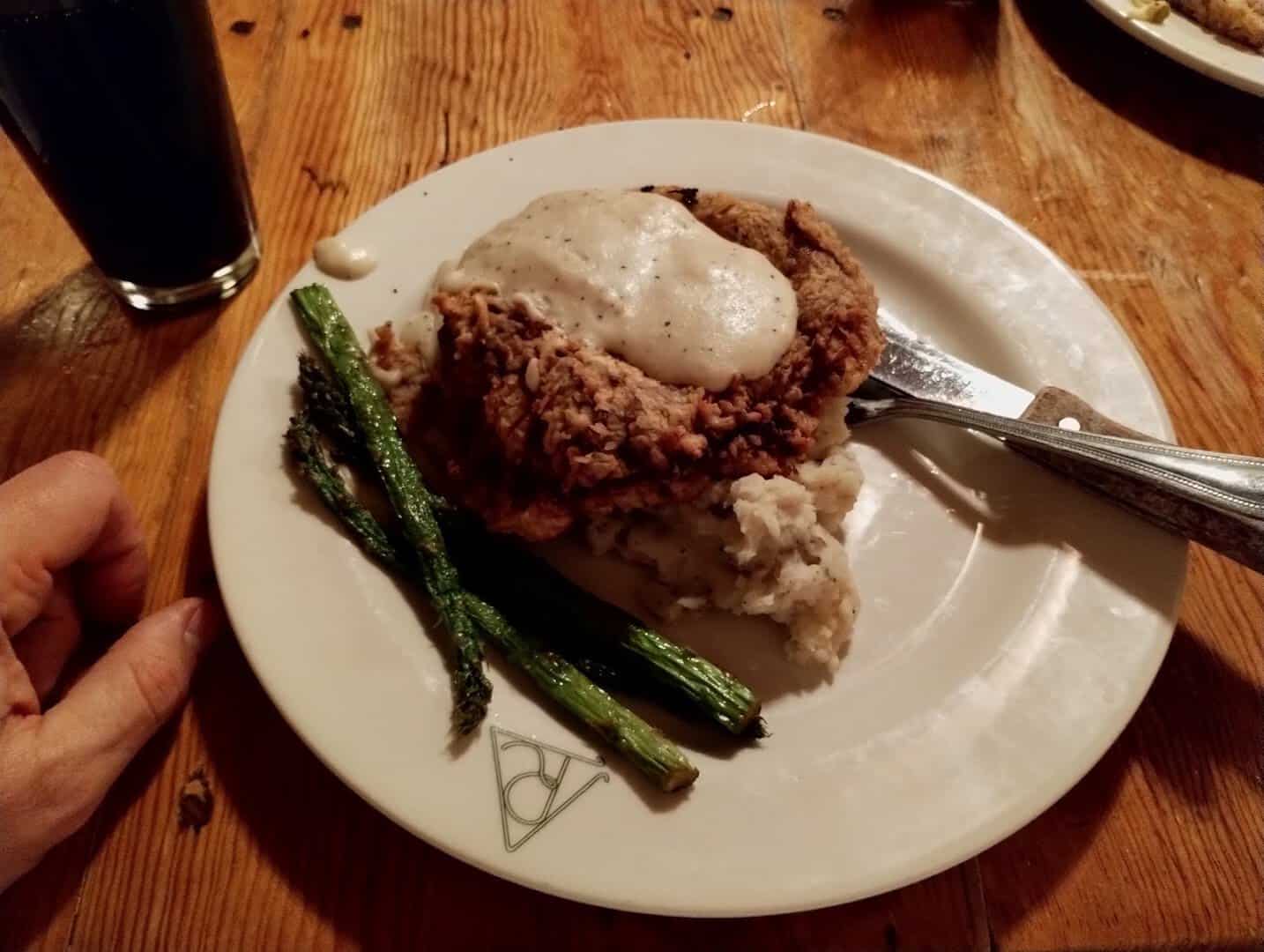 Chicken fried steak with cream gravy and asparagus at Reata in Alpine, Texas