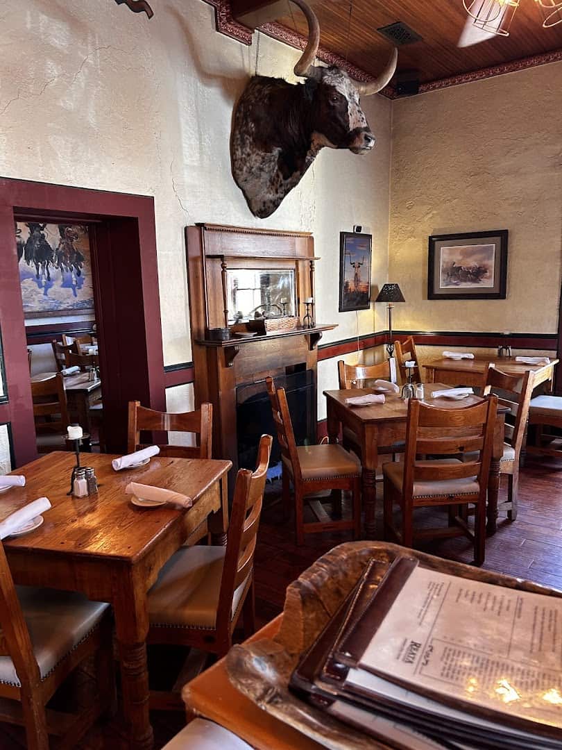 Mounted longhorn and Western decor in the dining room at Reata in Alpine, Texas