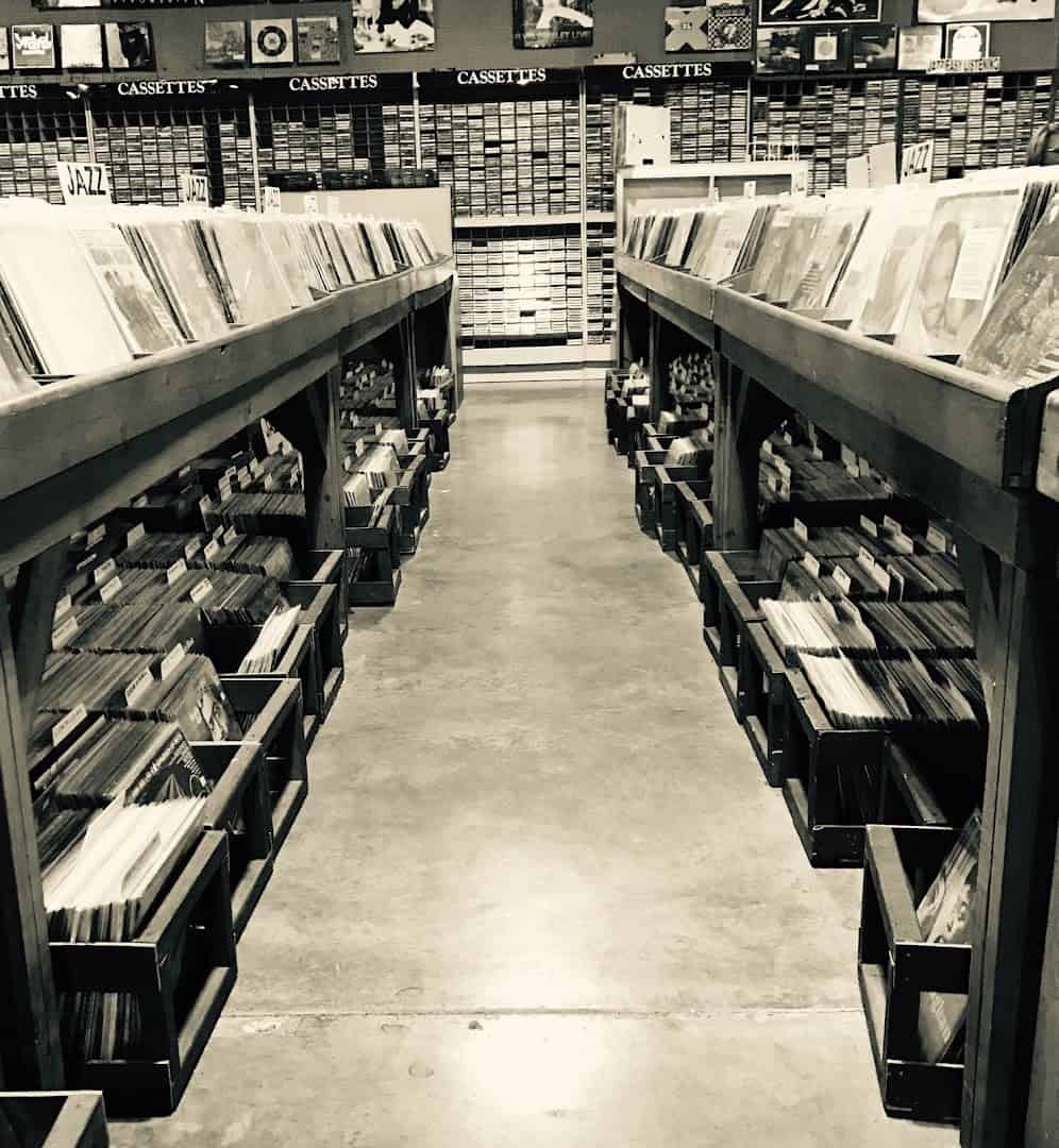 Long aisle of records at Forever Young Records in Grand Prairie, Texas