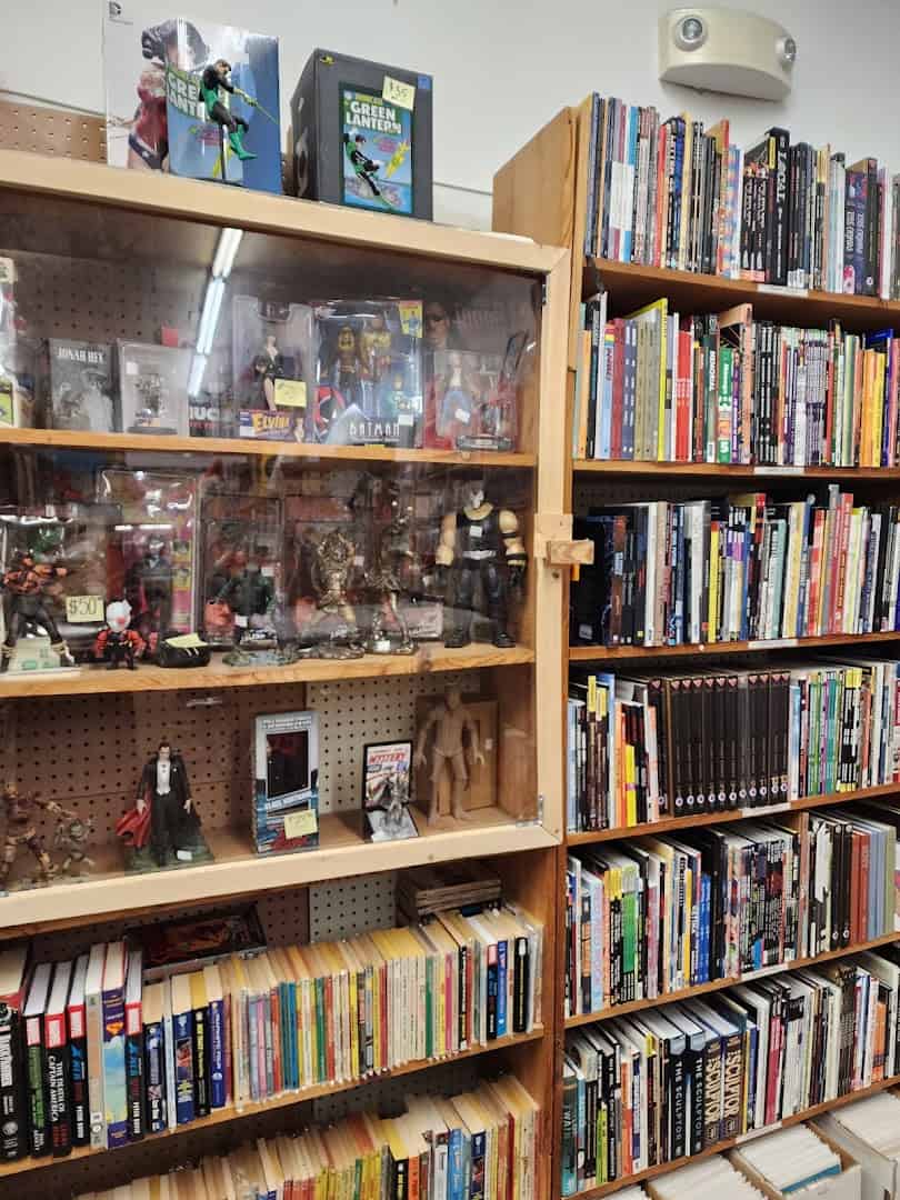 Glass display case of collectibles at Recycled Books in Denton, Texas