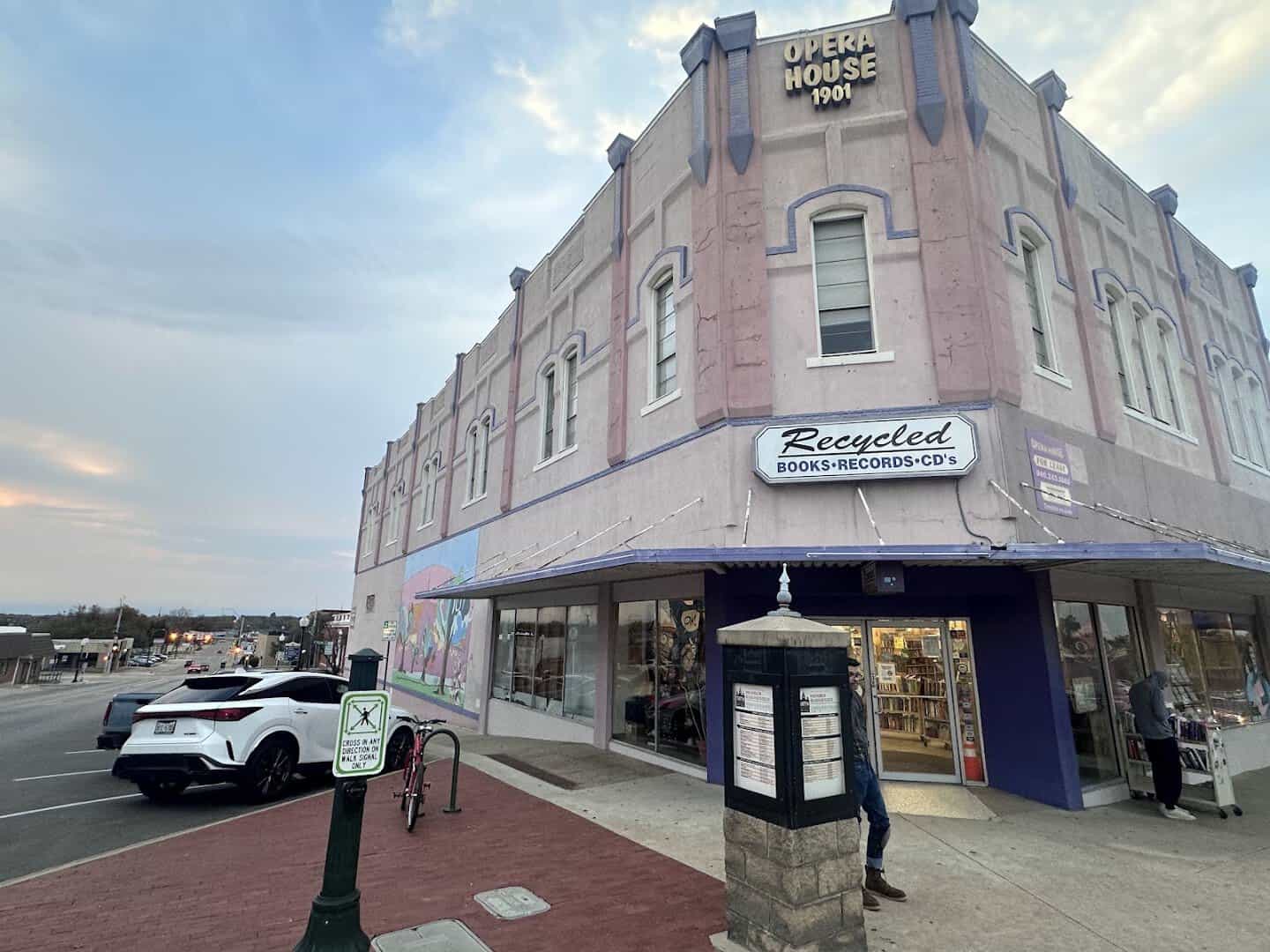 The purple Recycled Books building on the historic Denton, Texas square
