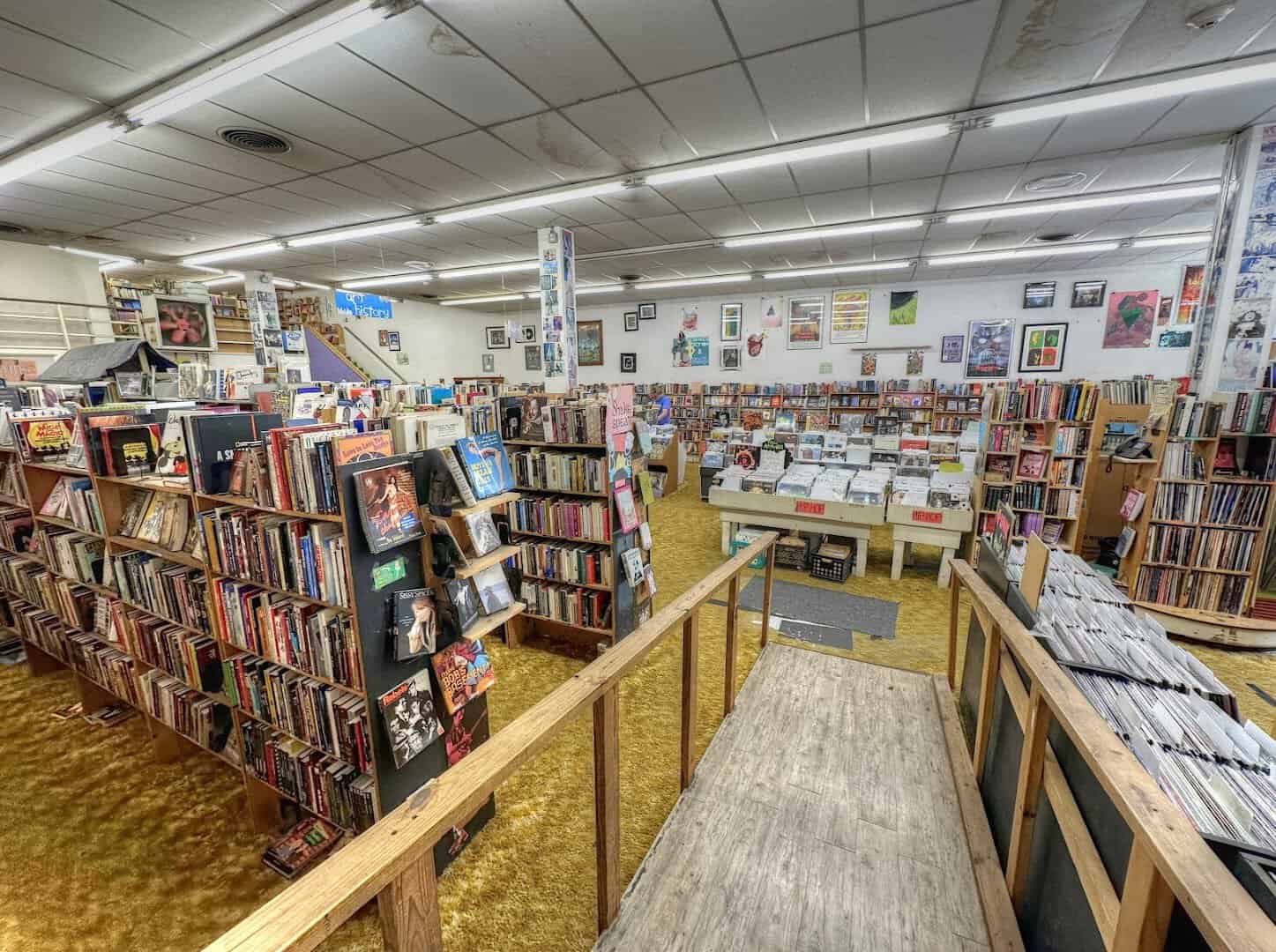 Upper-level view over the floors of book stacks at Recycled Books in Denton, Texas