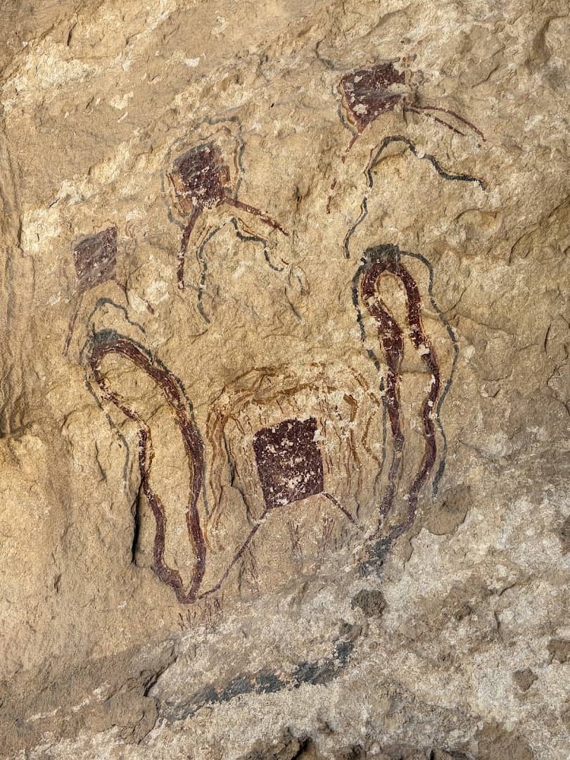 Red shaman figures in Pecos River style rock art at Seminole Canyon
