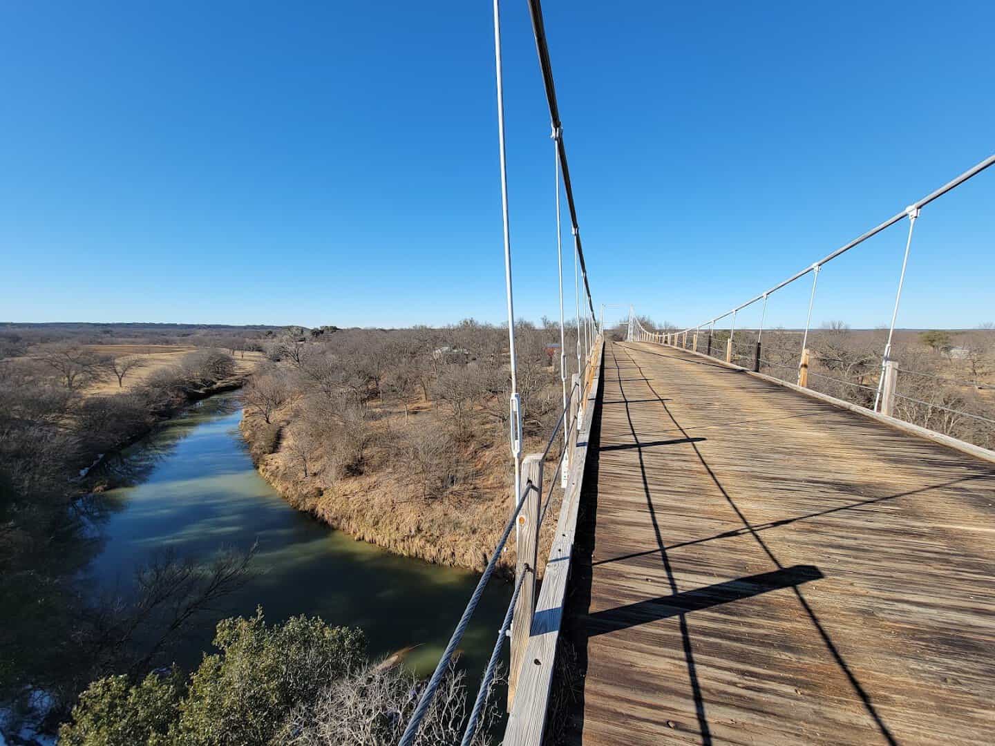 Side view of the Regency Suspension Bridge over the Colorado River between San Saba and Mills counties, Texas