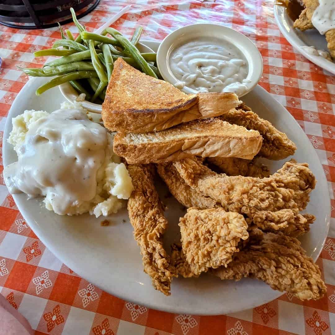Golden fried chicken strips with cream gravy, mashed potatoes and green beans at Richter's Antler Cafe