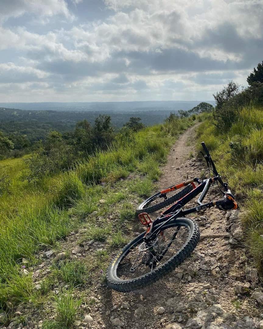Ridge top singletrack with a wide Hill Country vista at Flat Rock Ranch in Comfort