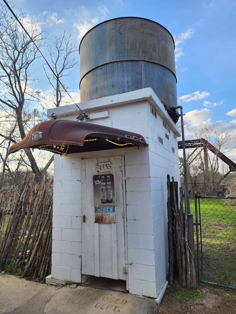 The old white water tower structure at Riley's Tavern in Hunter, Texas