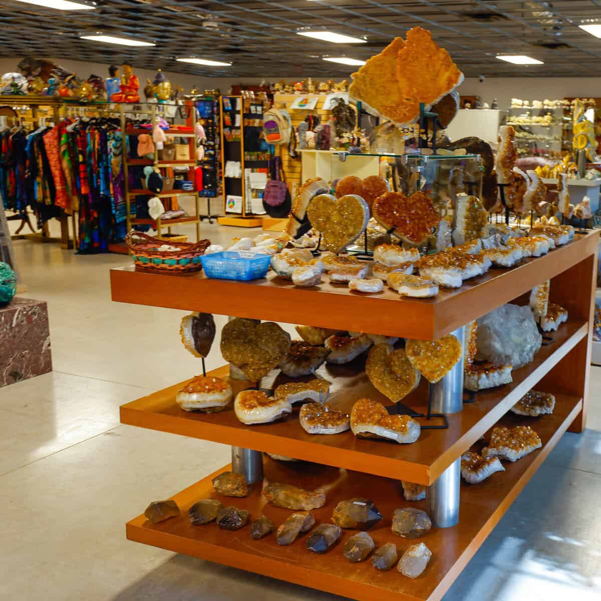 Shelves packed with citrine geode hearts and crystals inside Nature's Treasures in Austin
