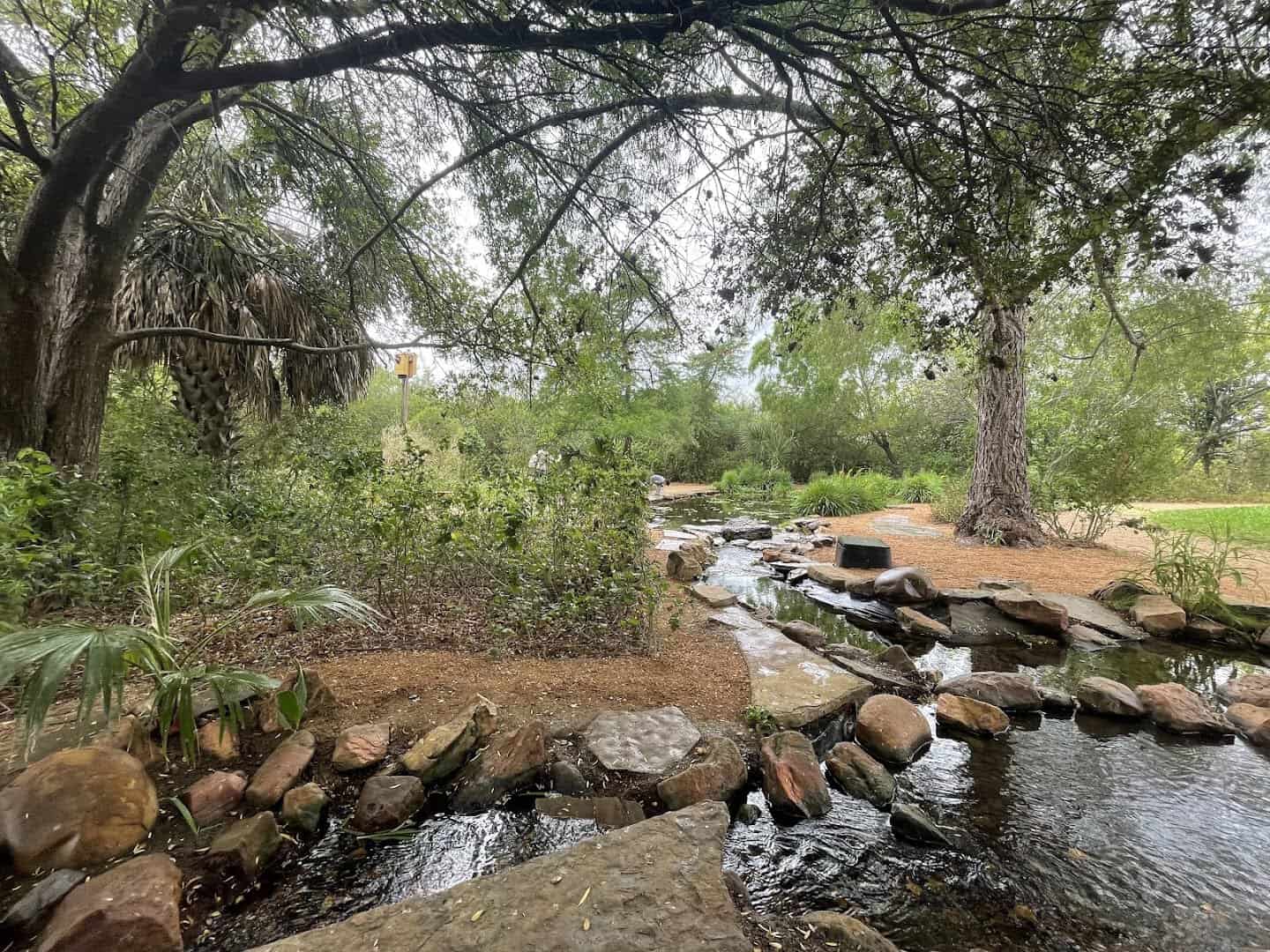 Rock waterfall water feature in the garden at Edinburg Scenic Wetlands in Edinburg, Texas
