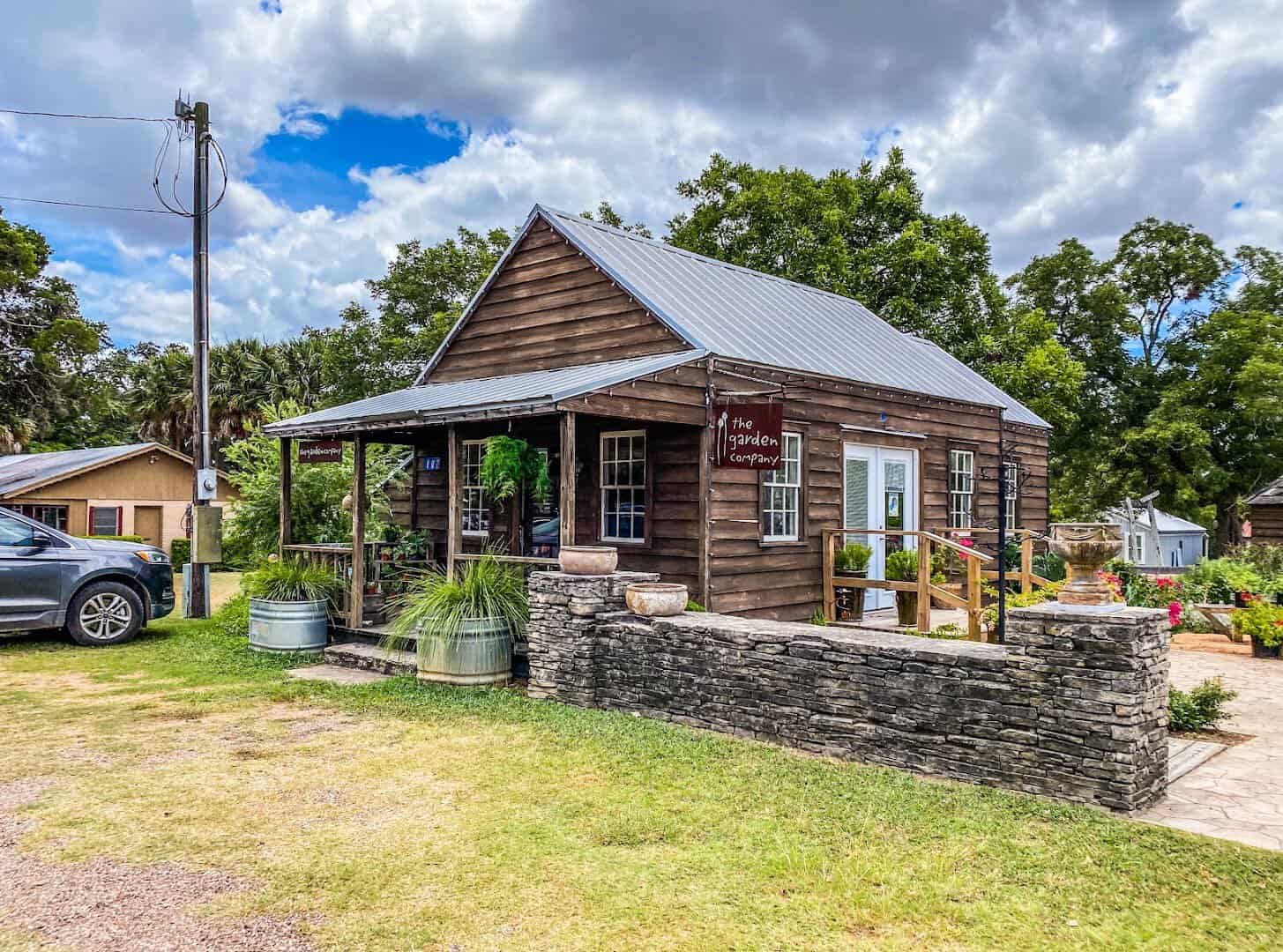 A restored 19th-century pioneer building with a porch at Henkel Square, Round Top, Texas
