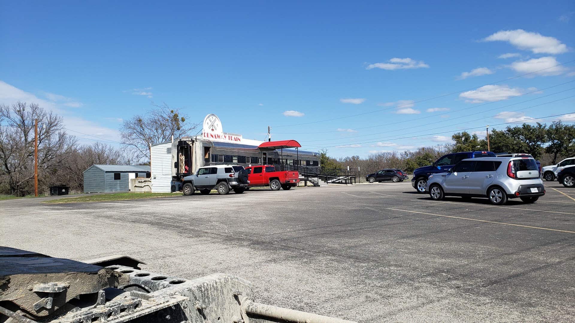 The Runaway Train Cafe rail car and parking lot in Brownwood, Texas